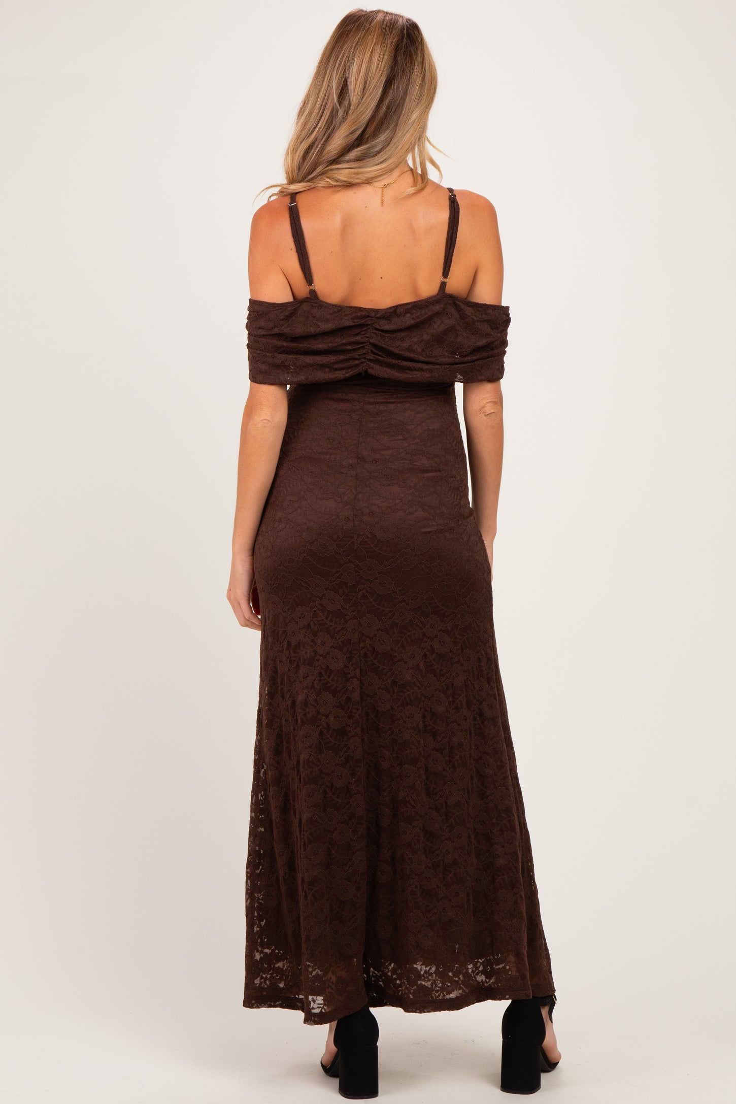 woman wearing a brown off-the-shoulder lace maternity maxi dress, showing a ruched back detail