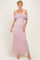 woman wearing a light pink off-the-shoulder lace maxi dress with ruched detailing and thin straps
