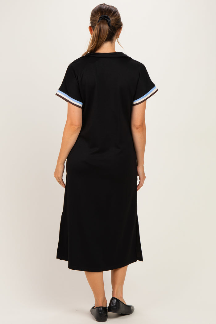 woman wearing a black maternity dress with short sleeves and striped details on the sleeves, view from the back