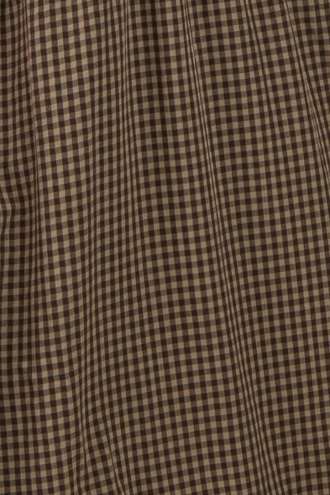 brown and beige gingham plaid fabric with a textured surface