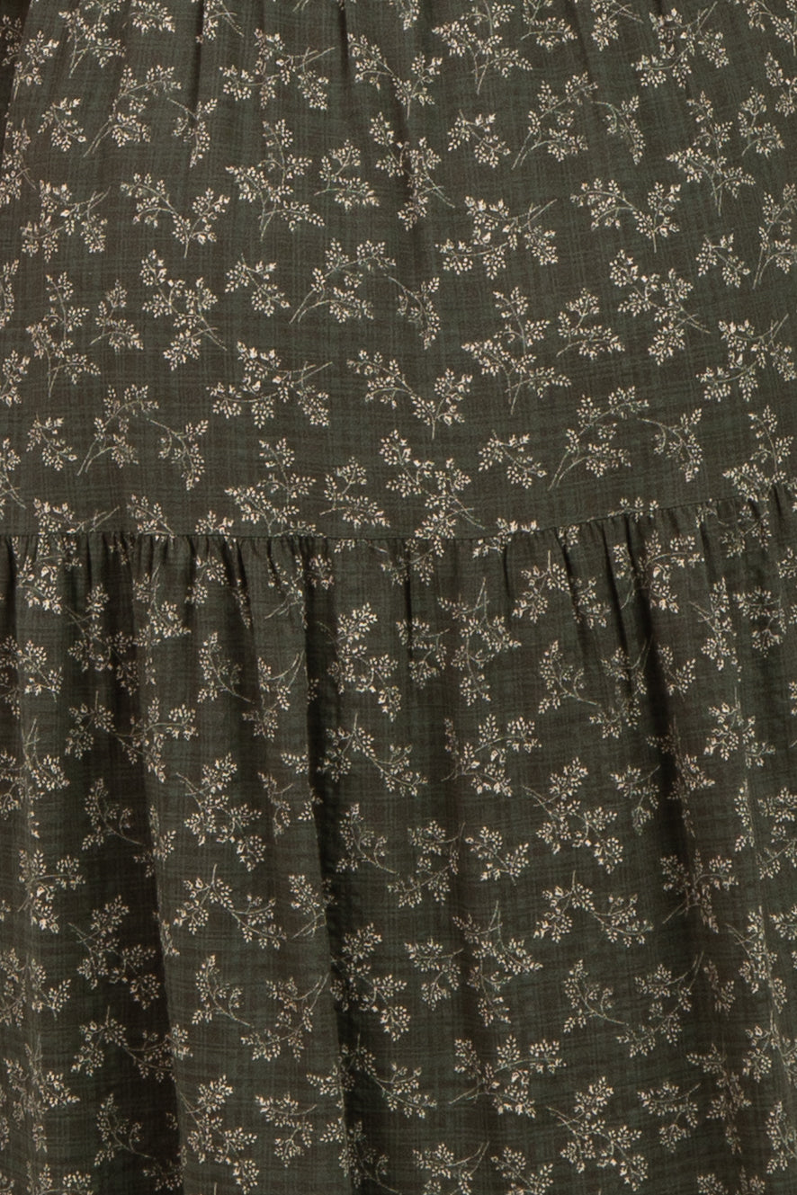 maternity wear in dark green with small floral print and tiered ruffle detailing