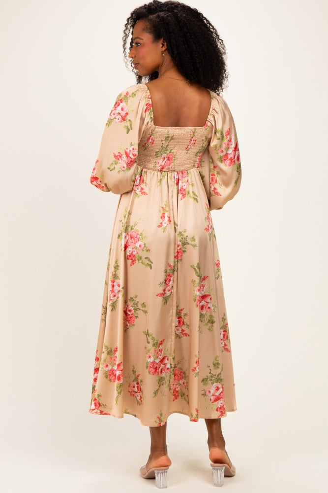 woman wearing a floral print long sleeve maxi dress with a smocked back and puff sleeves