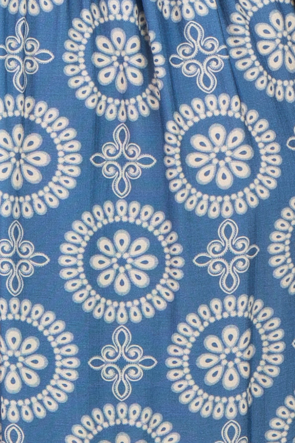 light blue maternity dress with white geometric pattern and relaxed fit