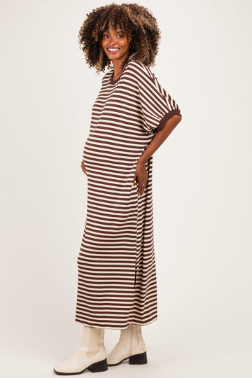 woman wearing a brown and white striped maternity dress with a relaxed fit and a visible baby bump
