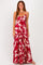 woman wearing a red and white floral maxi dress with adjustable straps and a gathered bust detail