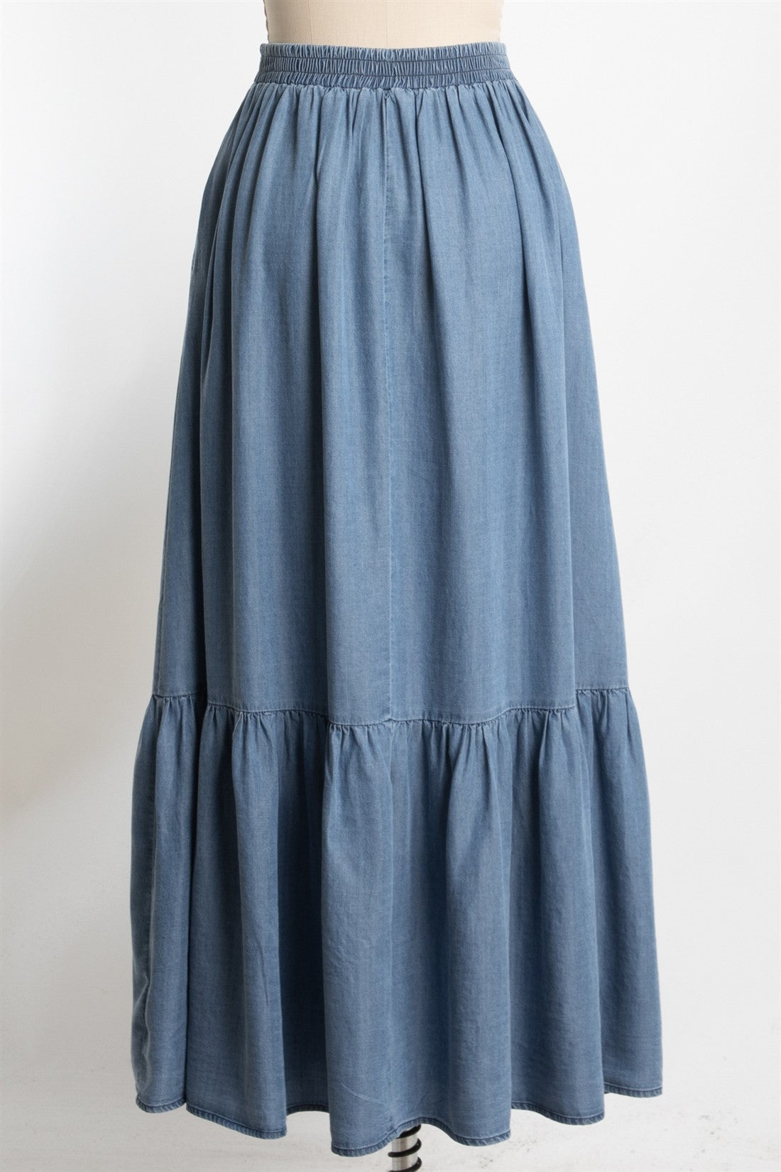 blue denim maxi skirt with a tiered ruffle detail and an elastic waist