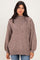 woman wearing a taupe oversized knit sweater with balloon sleeves and a high neckline