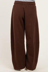 woman wearing brown wide-leg sweatpants with an elastic waistband and side pockets
