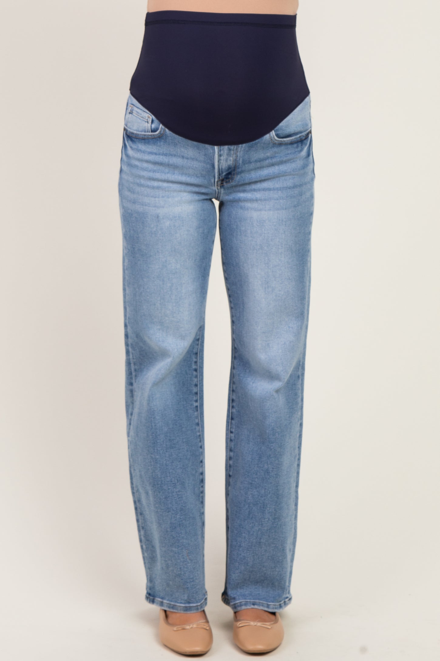 maternity wear blue straight leg jeans with a high waist band and pockets, designed for comfort during pregnancy