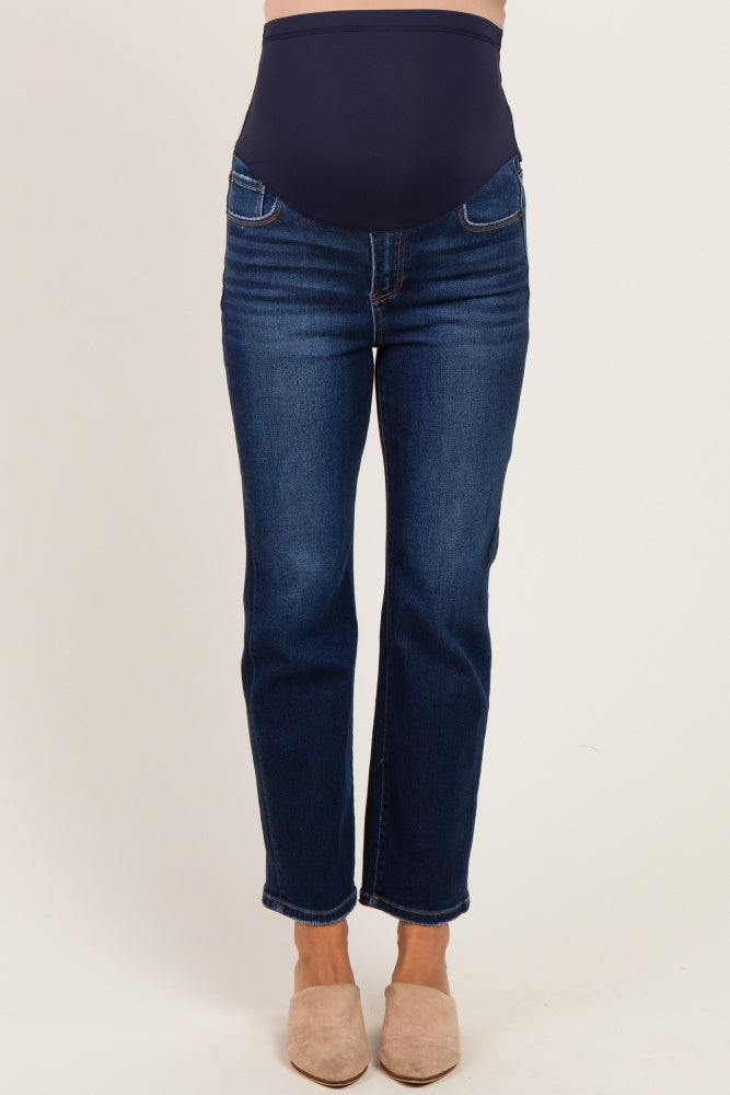 woman wearing dark blue maternity jeans with a supportive belly panel and straight leg cut