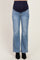woman wearing light wash flared maternity jeans with a navy blue over-the-bump panel