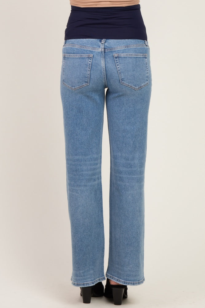 woman wearing light blue maternity jeans with a stretchy waistband, seen from the back