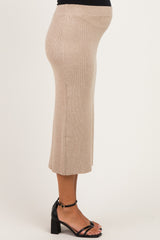 woman wearing a beige ribbed midi maternity skirt with a visible baby bump