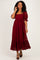 woman wearing a burgundy lace midi dress with puff sleeves and ruffle hem