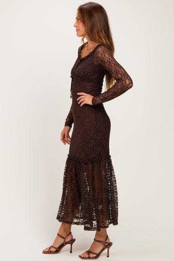 woman wearing a brown lace long sleeve maxi dress with a ruffled hem and a fitted bodice
