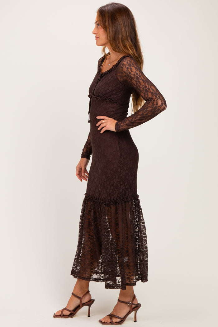 woman wearing a brown lace long sleeve maxi dress with a ruffled hem and a fitted bodice