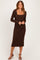 woman wearing a brown long sleeve midi dress with a square neckline and side ruching