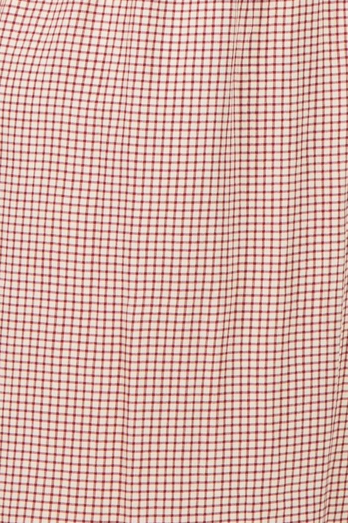 maternity wear in a red and white checkered pattern with a pleated design