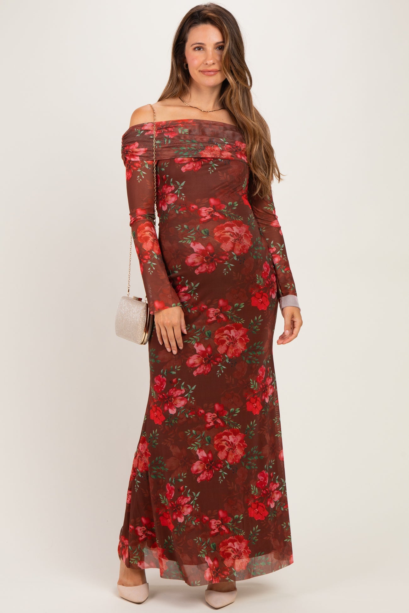 woman wearing a burgundy off-shoulder maxi dress with floral print, suitable for maternity wear