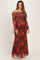 woman wearing a burgundy off-shoulder maxi dress with floral print, suitable for maternity wear