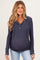 woman wearing a navy maternity hoodie with a button-up neckline and long sleeves, showing her baby bump