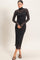 woman wearing a black sheer long sleeve midi dress with a mock neck and textured design