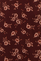 burgundy floral fabric with peach flowers and green leaves throughout