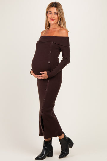 woman wearing a brown off-shoulder ribbed maternity dress with buttons and a visible baby bump