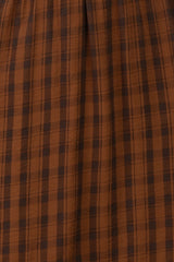 brown plaid midi skirt with a gathered waistline and soft fabric texture