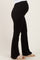 woman wearing black maternity flare pants with a visible baby bump