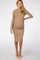 woman wearing a beige ribbed maternity dress with a thigh-high slit and long sleeves, showing her baby bump