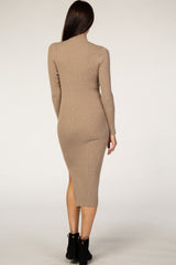 woman wearing a beige ribbed long sleeve midi dress with a side slit, shown from the back