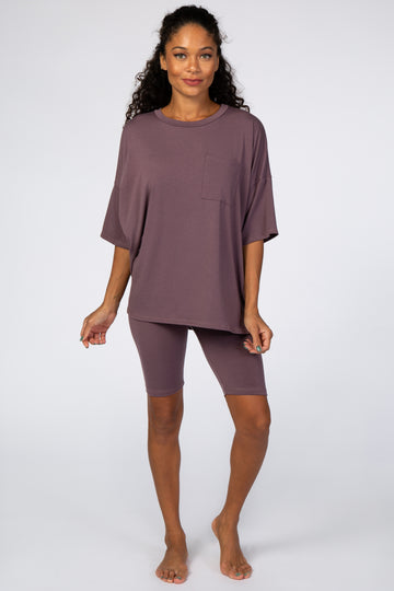 woman wearing a mauve oversized t-shirt with a pocket and matching bike shorts, casual loungewear look