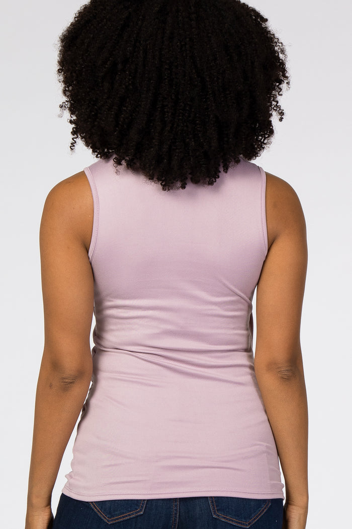 woman wearing a lavender sleeveless top, viewed from the back, showcasing a form-fitting silhouette