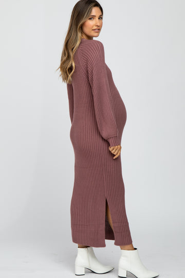 woman wearing a dusty rose ribbed maternity maxi dress with side slits and a visible baby bump