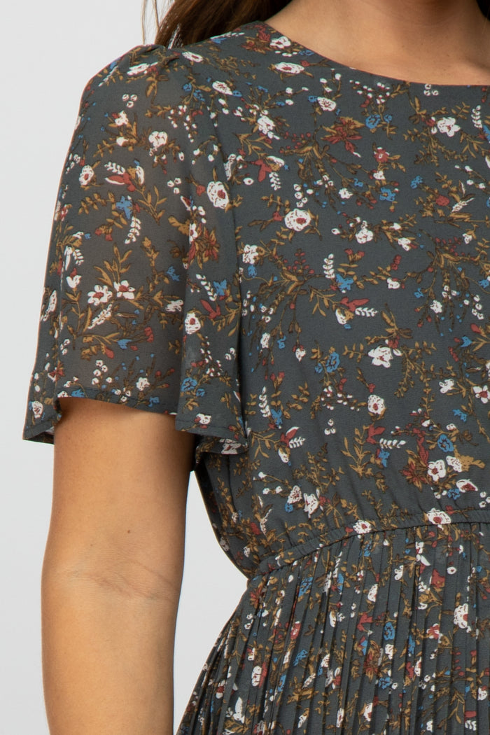 maternity wear featuring a dark floral pattern with short flutter sleeves and a flowy silhouette