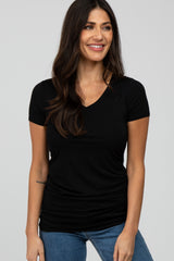 woman wearing a black short sleeve v-neck t-shirt and blue jeans