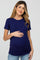 woman wearing a navy blue short sleeve maternity top and holding her baby bump