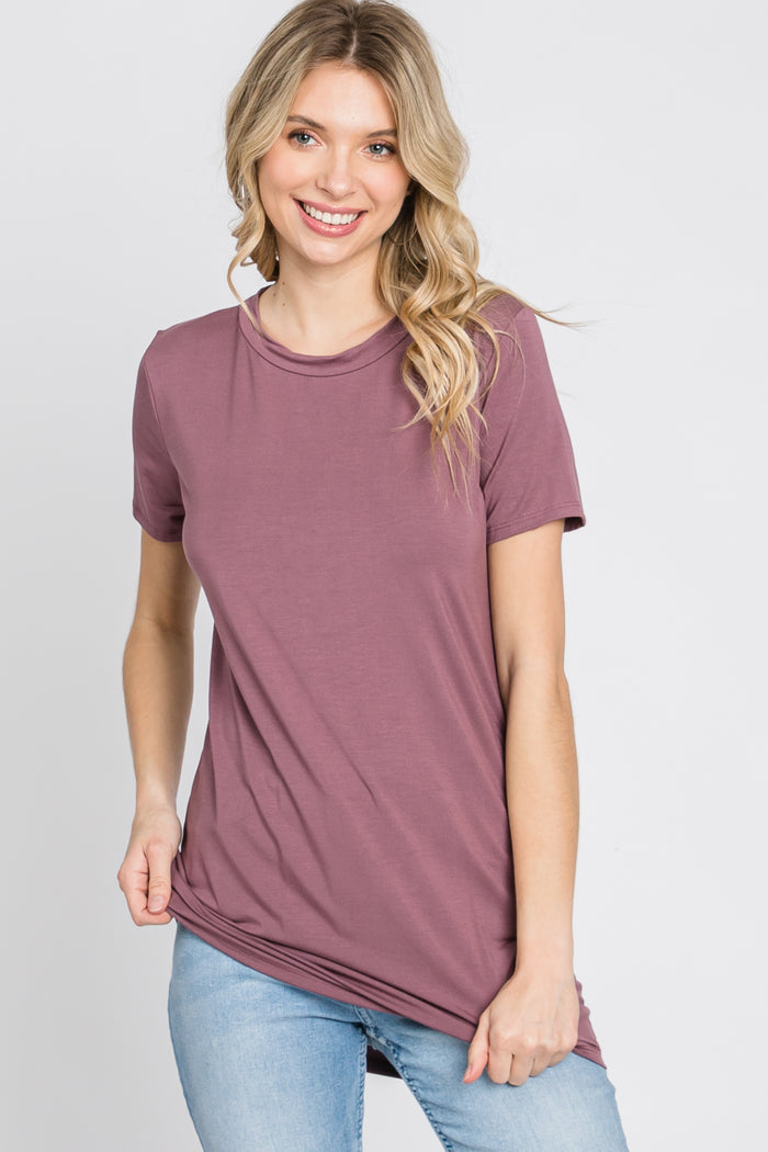 woman wearing a mauve short sleeve t-shirt with a relaxed fit and round neckline
