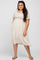woman wearing a short sleeve floral print plus size dress with a square neckline and flowy hem