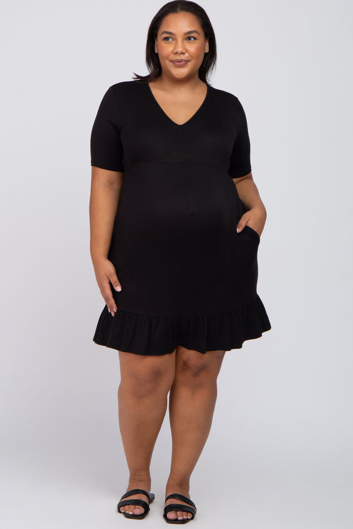 woman wearing a black maternity dress with short sleeves and a ruffled hem, featuring a visible baby bump and pockets