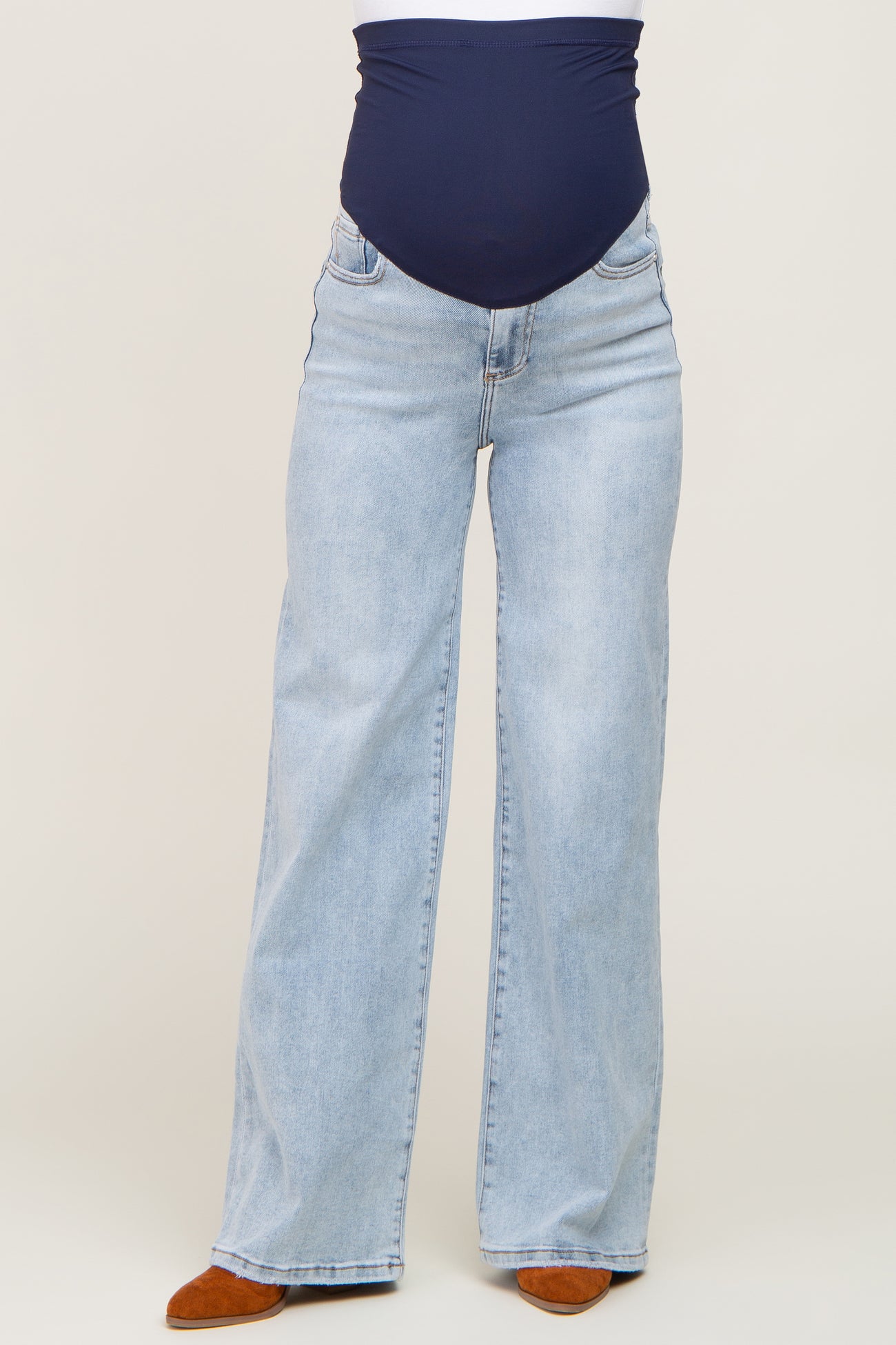 maternity wear light blue wide-leg jeans with a navy blue over-the-bump waistband