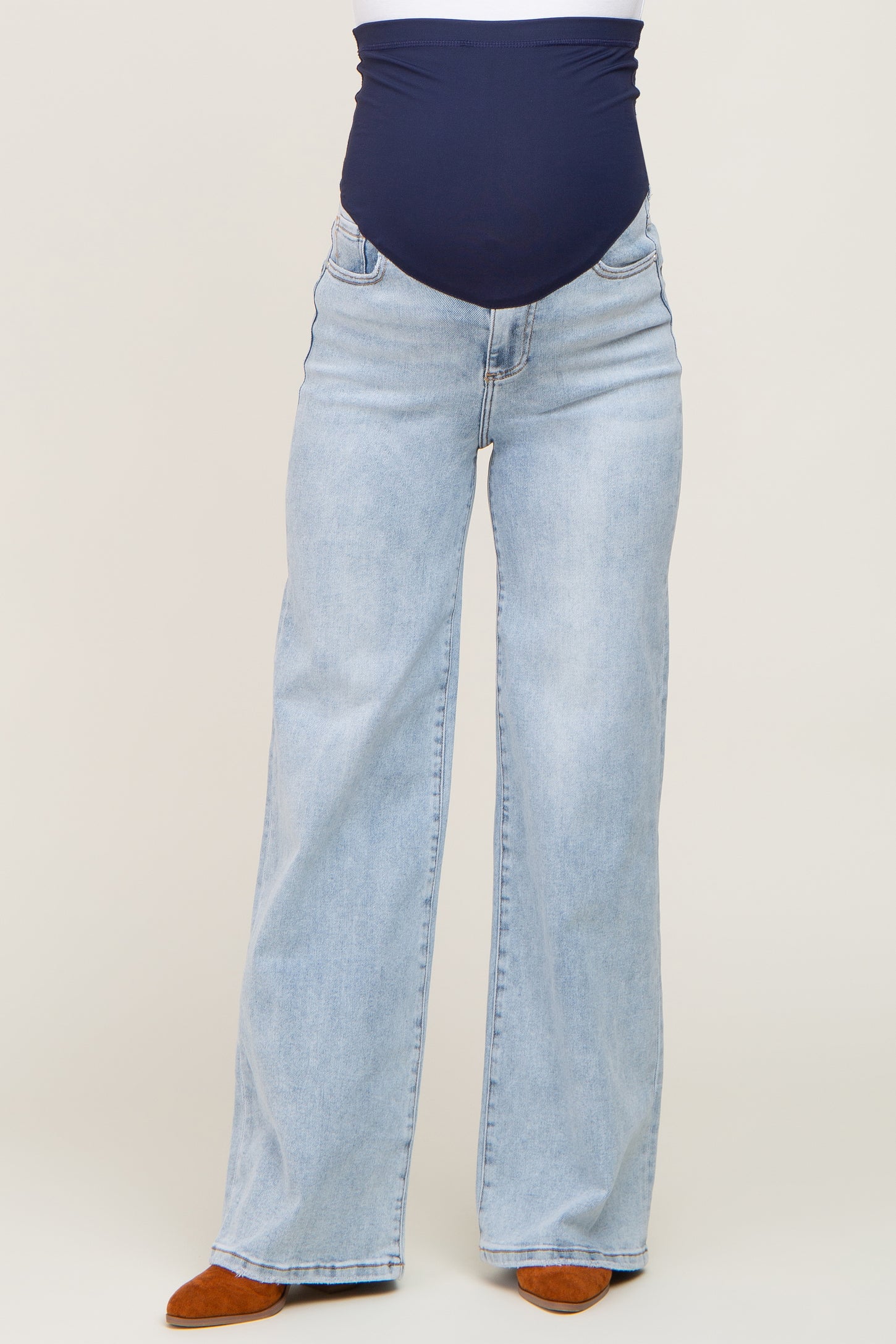 maternity wear light blue wide-leg jeans with a navy blue over-the-bump waistband