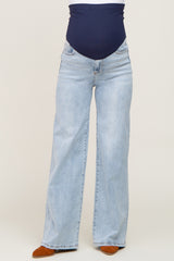 maternity wear light blue wide-leg jeans with a navy blue over-the-bump waistband