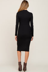 woman wearing a black long sleeve fitted maternity dress, shown from the back