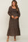 Pregnant woman in a leopard print smocked maternity maxi dress with long sleeves and square neckline
