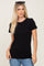 woman wearing a fitted black short sleeve t-shirt with a round neck and sunglasses on her head