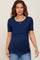 woman wearing a navy blue short sleeve maternity top with a crossover design and visible baby bump