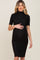 woman wearing a black short sleeve maternity dress with a high neckline and scalloped edges, showing her baby bump