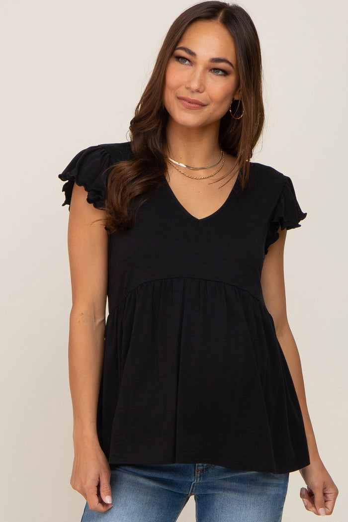 woman wearing a black v-neck maternity top with ruffle sleeves and blue jeans
